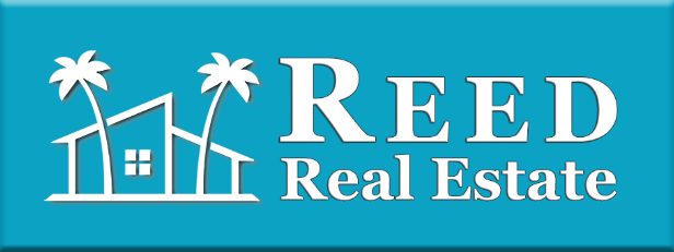 A blue sign with the words 're al estate ' written in white.