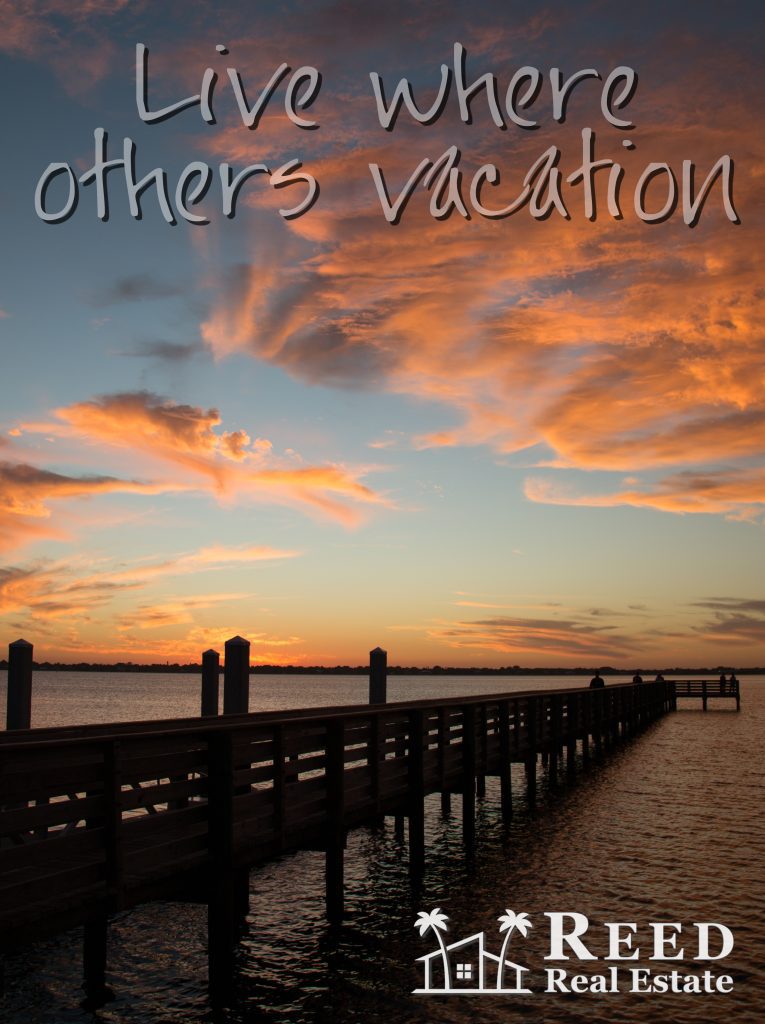 A pier with the words " others vacation " written above it.